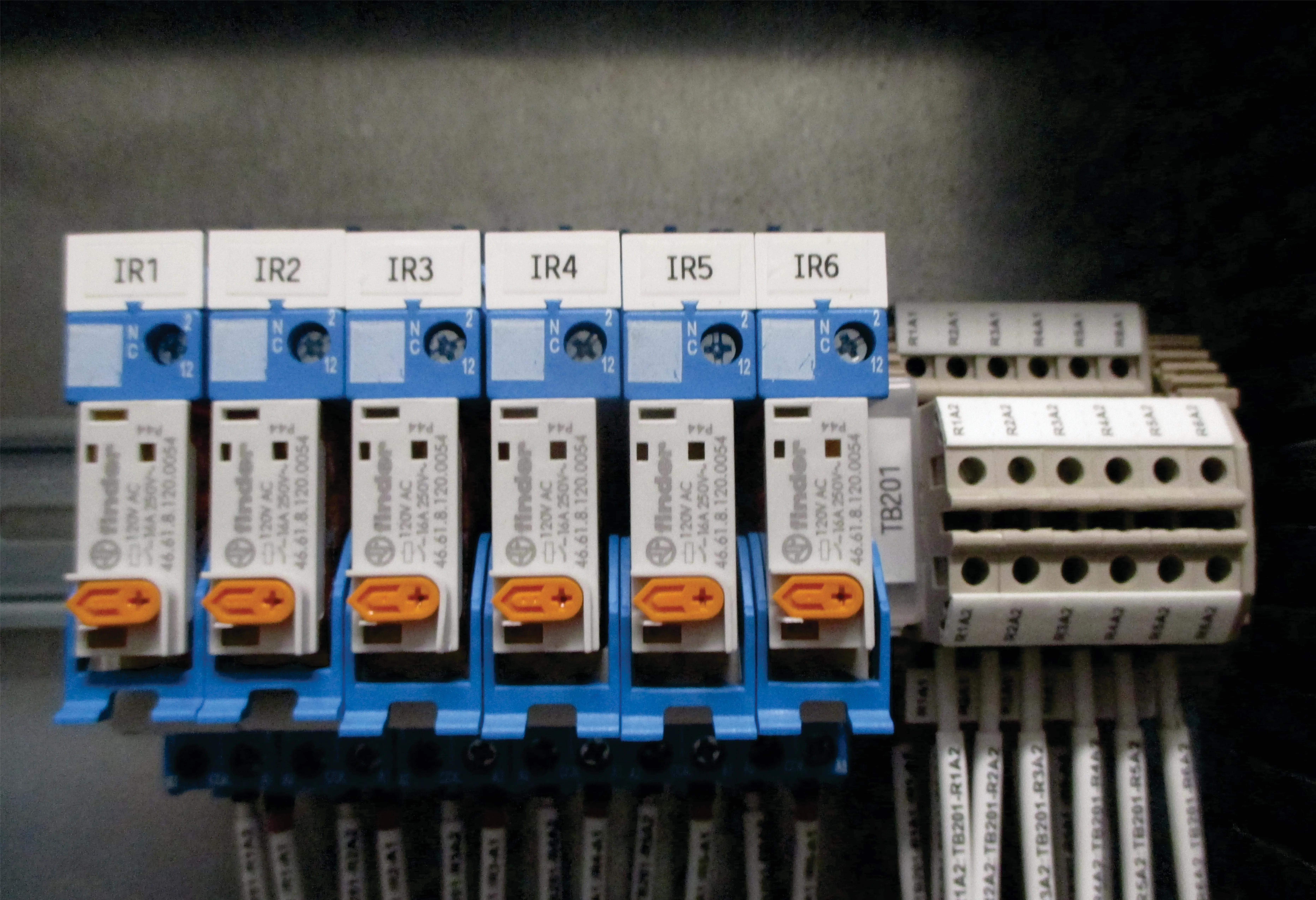 Multidisciplinary engineering team designing control panel solutions for industrial automation